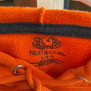 Orange sweatshirt with royal blue lettering